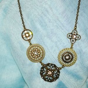 Pretty brass tone necklace with a few rhinestones